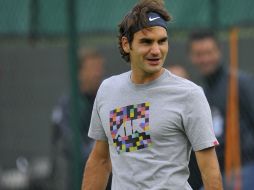 Roger Federer inicia hoy su camino hacia su séptima corona, enfrentando al colombiano Alejandro Falla. REUTERS  /