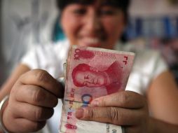 La moneda china podría impulsar la recuperación económica mundial. AP  /