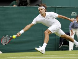 Roger Federer sufrió en demasía durante los primeros cuatro sets, contra Alejandro Falla, con un 6-0. AP  /