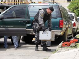 En el vehículo agresor se encontraron cartuchos, chalecos antibalas, una pistola y una granada de fragmentación. A. CAMACHO  /