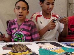 Los niños aprenden la historia antigua mediante talleres artísticos. EFE  /