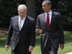 El presidente Barack Obama y el primer ministro israelí, Benjamin Netanyahu, caminan por los jardines de la Casa Blanca. AP  /