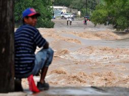 Ríos y arroyos en el estado se han desbordado, dejando graves daños a sus habitantes. EFE  /