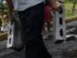 La ley generó fuertes enfrentamientos entre policías y opositores con un saldo de dos muertos. AFP  /