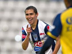 Paul Aguilar sonrie ante el triunfo de los Tuzos. MEXSPORT  /