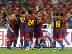 El Barcelona festeja su victoria en Asia. AFP  /
