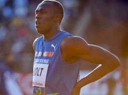El velocista jamaiquino, Usain Bolt, sufre de una lesión en la espalda baja. AFP  /