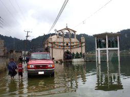 Las fuertes lluvias asociadas a la onda tropical 22 provocan el desbordamiento de la Laguna Zinacantán, Chiapas. EL UNIVERSAL  /