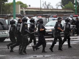 El periódico dijo que a pesar de tener tan cerca a los policías, no se sienten protegidos; sienten crecer la amenaza. NOTIMEX  /