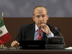 El Presidente Felipe Calderón defiende la propuesta de un mando policial único a nivel estatal. EFE  /