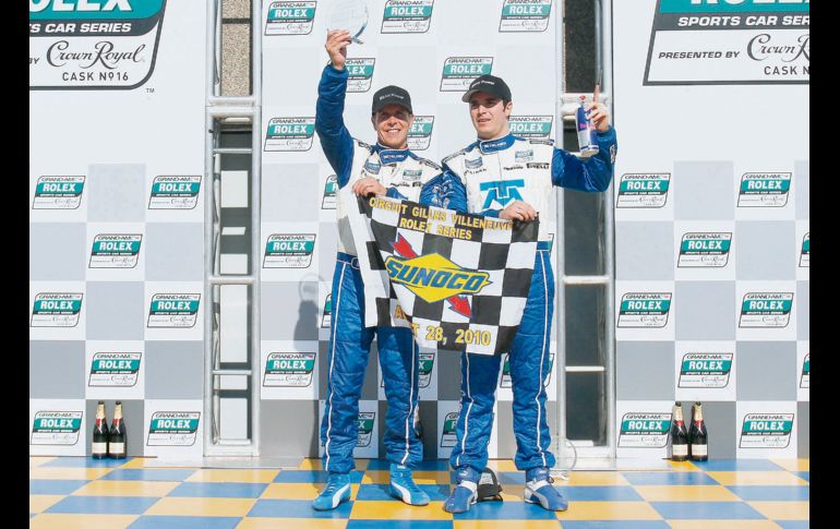 Scott Pruett y Memo Rojas celebran en lo más alto del podio en Montreal, Canadá. AFP  /