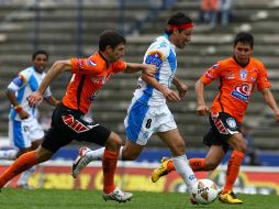 Foto de acción del duelo entre el Puebla ante el Pachuca. MEXSPORT  /