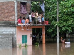 Las lluvias son derivadas del impacto de la depresión tropical 11-E en tierras oaxaqueñas. AP  /