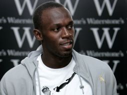 El atleta jamaicano expresa su deseo de ser un futbolista profesional. AP  /