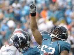 El equipo de Jaguares celebra su  victoria ante los los Broncos de Denver. AP  /