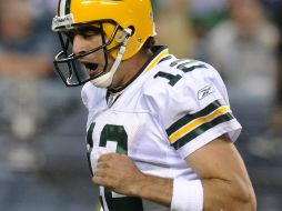 Aaron Rodgers celebra la anotación y que le daba la victoria a su equipo. AP  /