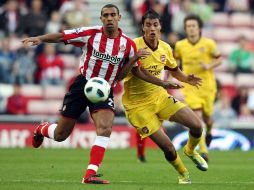 Aunque Arsenal anotó desde el minuto 13, perdió la ventaja en el último minuto. AP  /