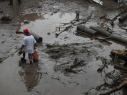 El desborde el río Cotaxtla cobró la vida de dos menores y una mujer. AP  /