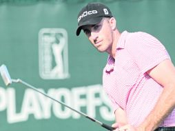 El australiano Geoff Ogilvy fue uno de los tres que comenzó con 66 impactos, cuatro bajo el par de campo. AP  /