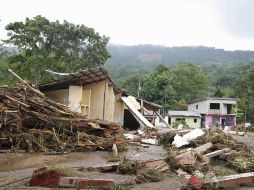 Desolación en Oxolotán, Tabasco. La tormenta tropical destruyó 210 viviendas por la crecida del río del mismo nombre. AP  /