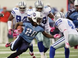 Chris Johnson desquició a la defensiva de Dallas y contribuyó con dos anotaciones. AP  /