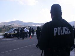 El vehículo del funcionario recibió al menos 15 impactos de arma de fuego. NTX  /