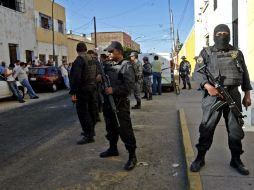 Los cuerpos fueron trasladados al Semefo de la ciudad en medio de un fuerte dispositivo de seguridad. E. BARRERA  /