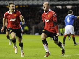 Rooney festejando su gol que le dio la victoria al Manchester United ante Rangers. REUTERS  /