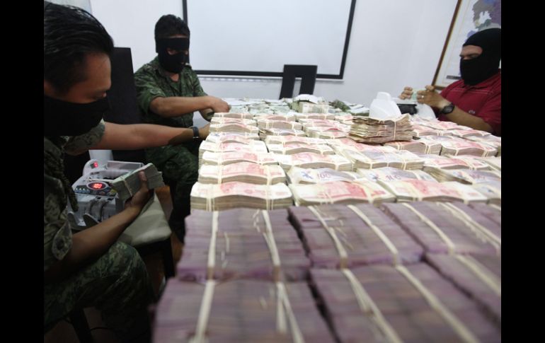 Dinero decomisado en un operativo. Procuradores del país apoyan reformas contra el lavado de dinero. REUTERS  /