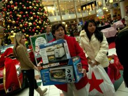 Los reportes del gasto de los consumidores tendieron a ser positivos. AFP  /