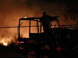 La granada que los atacantes lanzaron a la escolta que llevaba al secuestrador, provocó un pequeño incendio. AP  /