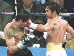 Manny Pacquiao (der.) en su reciente combate, en donde triunfó por decisión unánime sobre Antonio Margarito. REUTERS  /