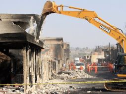 Aspecto de los trabajos de demolición de una de las 18 casas seleccionadas, afectadas por una explosión en Puebla. EFE  /