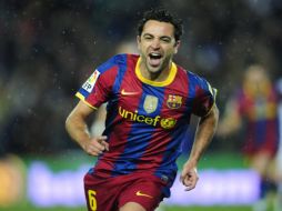 Xavi Hernández es uno de los candidatos para ser premiados por la FIFA. AP  /