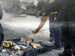 Policías investigan la escena del crimen. EFE  /