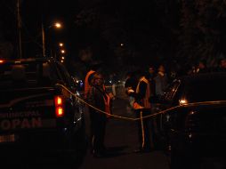 Elementos de la Policia de Zapopan acordonan el área en que asesinaron a un hombre en Zapopan. O. RUVALCABA  /
