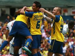Jugadores de las Águilas festejando una anotación del equipo. MEXSPORT  /