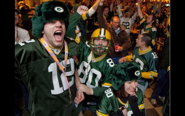 Los aficionados de los Empacadores de Green Bay festejan el campeonato de su equipo. AP  /