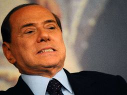 Berlusconi quiso transmitir hoy una imagen de normalidad y se centró en los logros económicos. AFP  /