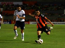 Luis Ricardo Esqueda (der.) selló la victoria del equipo chiapaneco al minuto 78. MEXSPORT  /