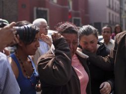 Maricela Reyes llega a la rueda de prensa que ofreció a los medios, luego de enterarse de la muerte de sus hermanos y su cuñada. AP  /