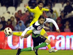 El Villarreal rescató el empate ante el Racing de Santender. AFP  /