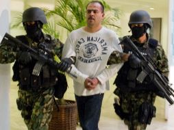 Esta mañana fue presentado 'El Toto' presunto criminal que está relacionado con la muerte de mandos policiacos y fuga de reos. AFP  /