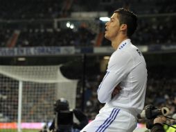 El jugador portugués, Cristiano Ronaldo,  en el duelo de ayer ante el Málaga. AFP  /