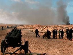 Opositores al gobierno de Gadhafi se enfrentan hoy a fuerzas armadas en Bin Jawad. REUTERS  /