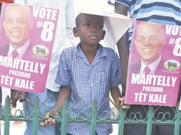 Un menor, durante un mitin del candidato presidencial Michael Martelly, en Hinche. REUTERS  /