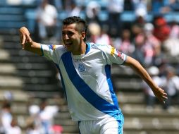 Yasser Corona festeja su anotación con la que el Puebla consiguió la victoria. MEXSPORT  /