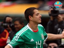 'Chicharito' festeja una de las anotaciones que marcó frente a Paraguay. MEXSPORT  /
