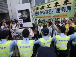 Los organizadores instaron a las autoridades chinas a liberar al creador y a restaurar la dignidad y los derechos humanos de él. AP  /
