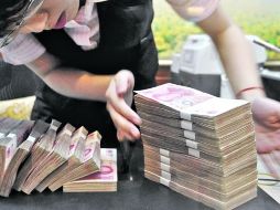 China podría cubrir gran parte de las necesidades financieras de España con su inversión de 13 MMDD. ARCHIVO  /